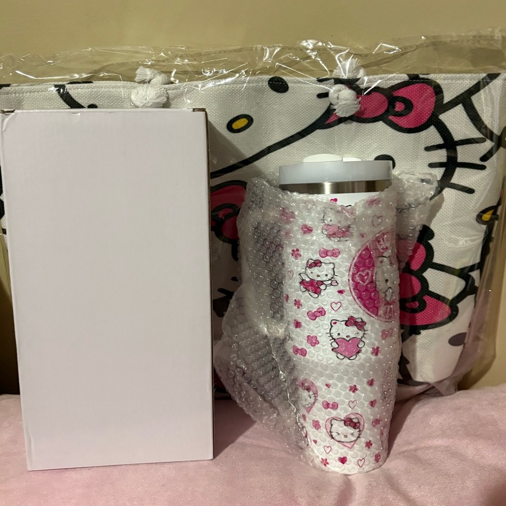 Moving sale! Hello Kitty tire bag and 40oz tumbler set new